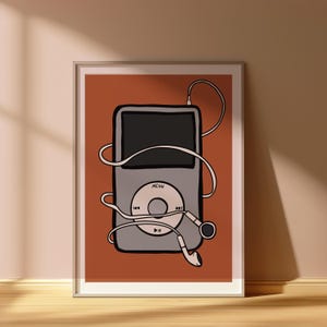 May include: A framed illustration of a classic digital music player with headphones. The player is gray with a black screen and a circular control pad. White headphones and cord wrap around the player against a burnt orange background.