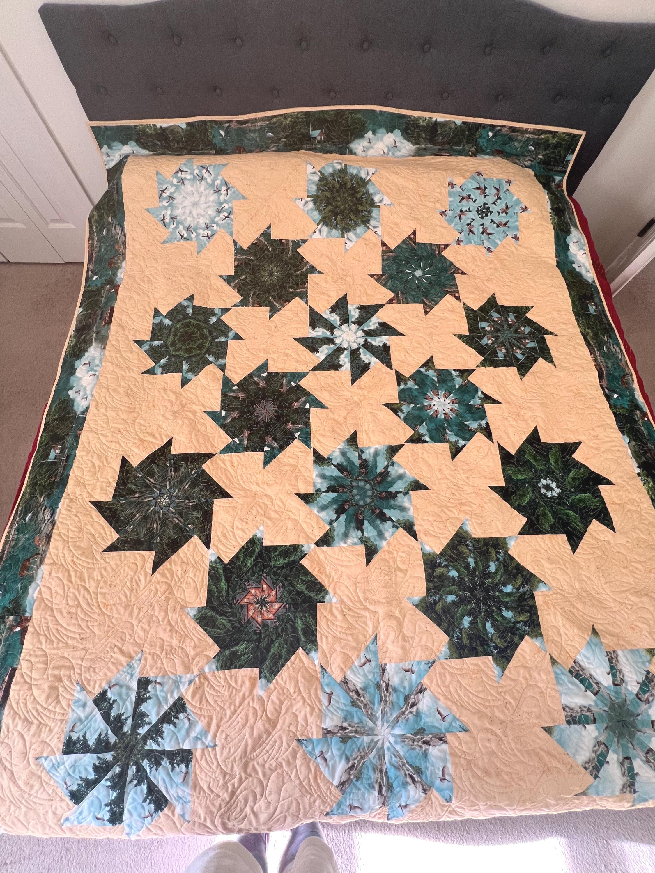 Kaleidoscope custom-designed queen-sized quilt, quality fabrics with the US national parks pictured on the reverse side.