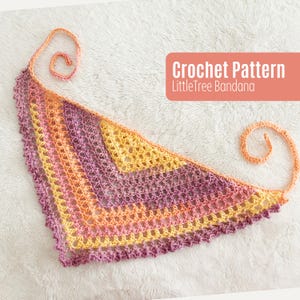 May include: A crocheted bandana in shades of yellow, orange, and purple. The triangular scarf features a lacy design and a decorative edge. The text "Crochet Pattern LittleTree Bandana" is displayed on the image.
