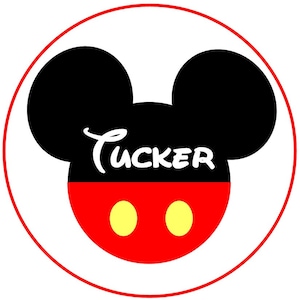 May include: A red and black Mickey Mouse head with the name "Tucker" written in white cursive. The head is on a white background with a red circle around it.