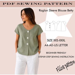 May include: A PDF sewing pattern for a Raglan Sleeve Blouse Betty, featuring a sage green short-sleeve blouse with three white buttons. The image includes technical line drawings, size range XXS-XXXL, and format options A4, A0, and US Letter.