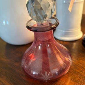 May include: A rustic wooden sign with the text "Welcome to our home" in a handwritten style. The sign features a distressed finish and a simple, inviting design, perfect for a front porch or entryway.