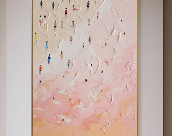 May include: A vertical rectangular painting in a gold frame featuring a textured, impasto-style beach scene. Numerous tiny figures in colourful clothing are scattered across a pale pink and cream sandy shore and light pink water.