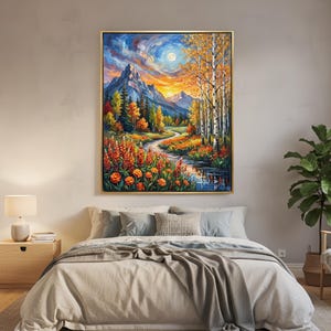 May include: A framed landscape painting depicts a mountain scene with a river winding through a valley. The artwork features vibrant colors of orange, yellow, and blue, with a full moon in the sky. The painting is displayed above a bed.