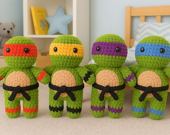 May include: Four handmade crochet dolls resembling Teenage Mutant Ninja Turtles. Each doll is green with a different colored mask: red, yellow, purple, and blue. They have tan bellies, black belts, and matching colored accents on their limbs.