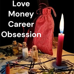 May include: A still life arrangement featuring a red candle with a lit flame, small glass bottles with cork stoppers, and a red drawstring bag. The words "Removals, Love, Money, Career, Obsession" are displayed in white text.