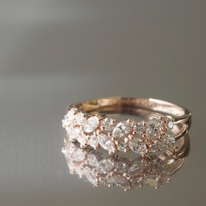 Marquise and round diamond eternity-style ring