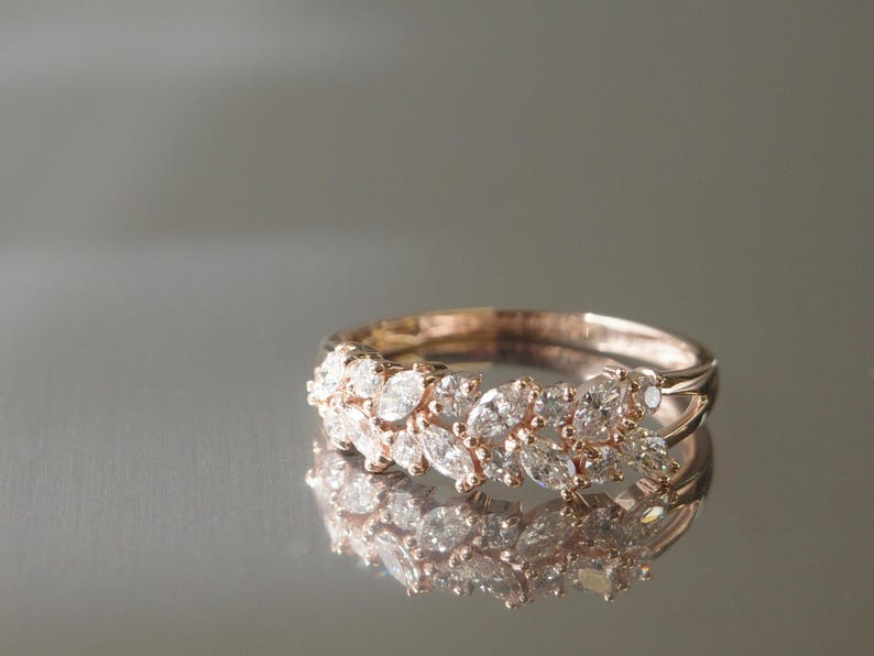 Marquise and round diamond eternity-style ring