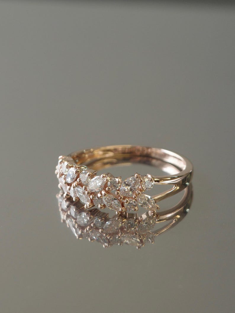 Close-up of marquise diamond band reflecting soft light
