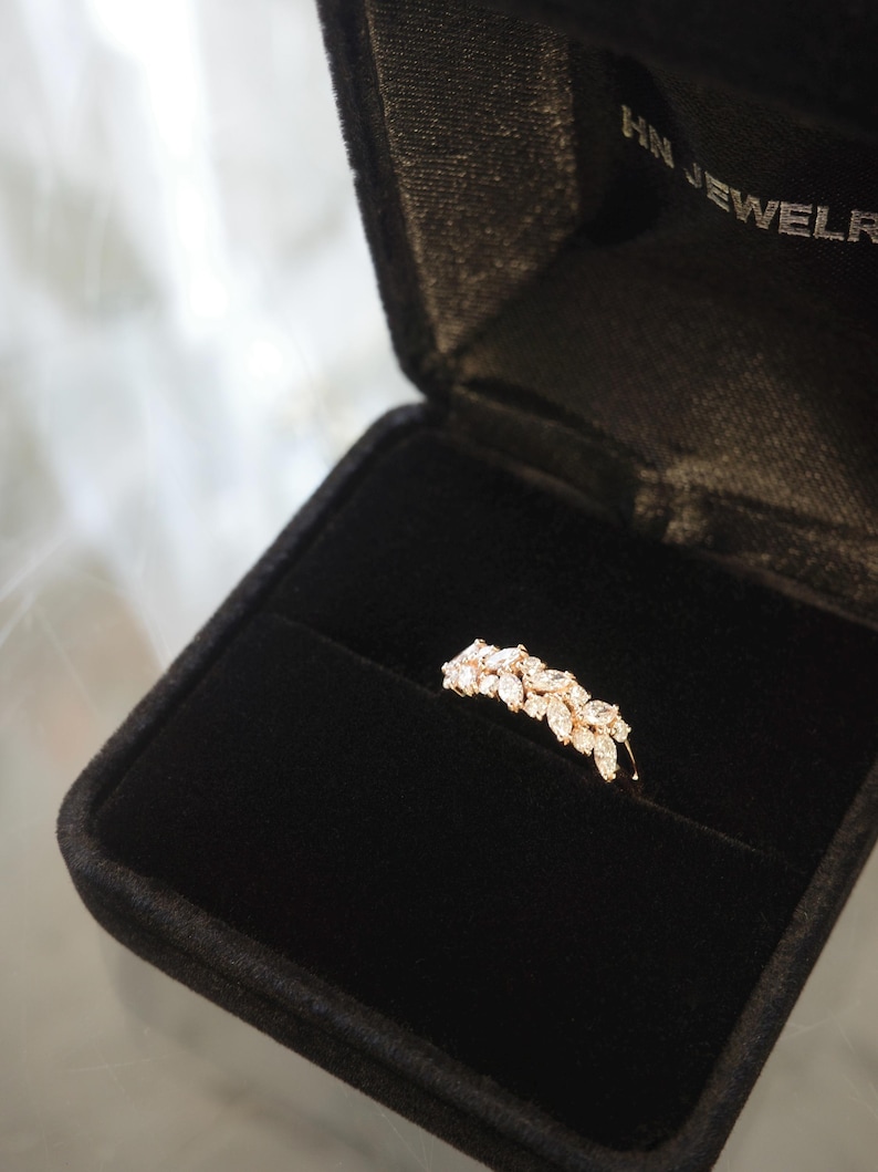 unique women wedding ring with marquise diamond and round diamond