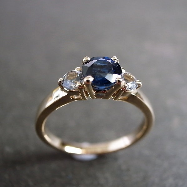 Blue Sapphire and White Sapphire Three Stone Engagement Ring in 14K Yellow Gold