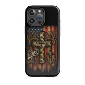 May include: Black phone case featuring a design with a cross, deer antlers, a fish, and an anchor. The background displays a distressed American flag in red, white, and blue.
