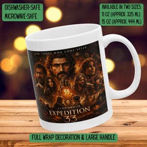 May include: White ceramic mug with a wraparound design featuring a group of people and the text "EXPEDITION 33". The mug is available in two sizes: 11 oz and 15 oz. It is dishwasher and microwave safe, with a large handle.