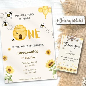 May include: A bee-themed birthday invitation with a matching thank you tag. The invitation features a yellow beehive, bees, sunflowers, and the text "Savannah's 1st Bee-Day". The tag reads "Thank you for buzzing by!"
