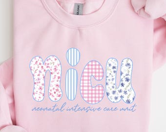 May include: A pale pink sweatshirt featuring the word "NICU" in a bubble font. The letters are decorated with floral, striped, and gingham patterns. The text "neonatal intensive care unit" is below.