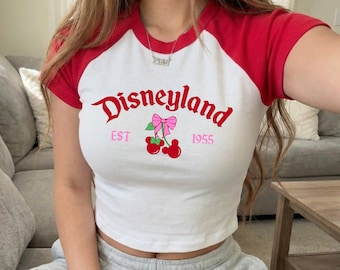 Disneyland Cherry Mouse Rosa Coquette Est 1955 Baby T-Shirt, Disneyland Crop Top, Coquette Disney Raglan Y2K Shirt, Disneyland Trip Outfit
