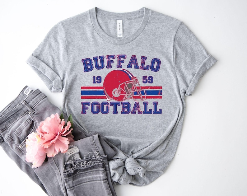 a shirt that says buffalo football with a helmet on it