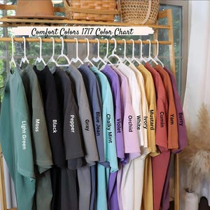 a rack with a variety of shirts hanging on it
