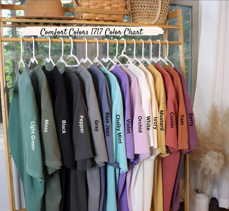a rack with a variety of shirts hanging on it