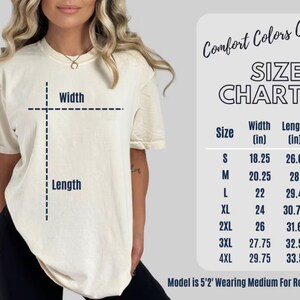 a woman wearing a white t - shirt with measurements