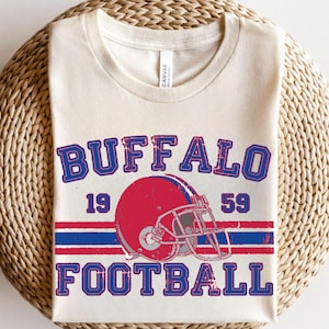 a buffalo football t - shirt on a wicker basket