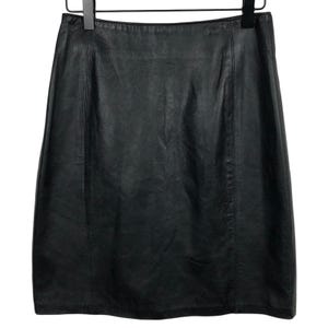 May include: A black leather skirt featuring a straight silhouette, a high waistband, and vertical seam detailing running down the front panels. The garment is constructed with a smooth, matte finish and is displayed hanging from a black hanger.