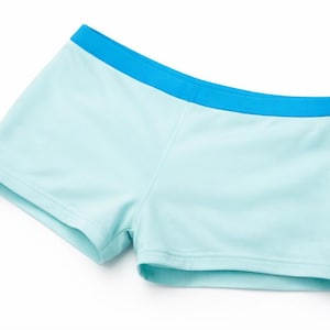 May include: Light blue shorts with a contrasting bright blue waistband. The shorts are made of a smooth, likely synthetic fabric. The garment is designed for comfort and activity.