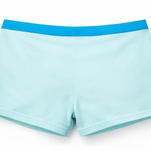 May include: Light blue athletic shorts with a contrasting bright blue waistband. The shorts are a solid color and appear to be made of a soft, comfortable material. The shorts are designed for athletic activities.