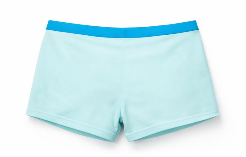 May include: Light blue athletic shorts with a contrasting bright blue waistband. The shorts are a solid color and appear to be made of a soft, comfortable material. The shorts are designed for athletic activities.