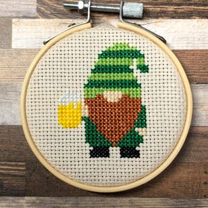 May include: A set of three ceramic mugs with a speckled, matte finish. The mugs are in shades of cream, light gray, and dark gray. Each mug has a simple, minimalist design, perfect for coffee or tea.