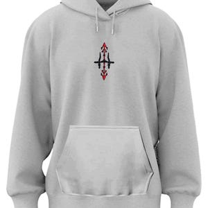 A gray hoodie with a small graphic design on the front.