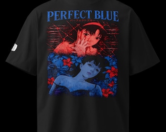May include: A black short-sleeve t-shirt featuring a graphic print with the text PERFECT BLUE. The design shows two stylized figures, one in red tones with a hand near the face and one in blue tones surrounded by red and blue floral elements.