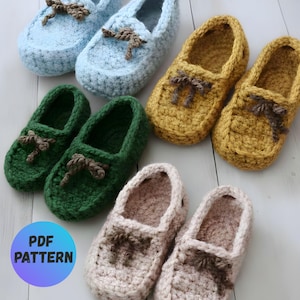 May include: A collection of handmade crochet slippers in various colors: light blue, green, mustard yellow, and light pink. Each slipper features a decorative bow and a moccasin-style design. The image includes a circular graphic with the text "PDF PATTERN".