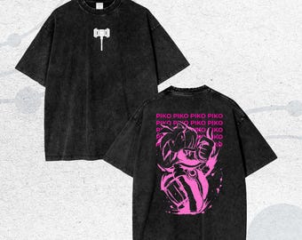 May include: Black oversized t-shirt with a white hammer graphic on the front and a pink graphic on the back. The back graphic features a character with the text "PIKO" repeated multiple times.