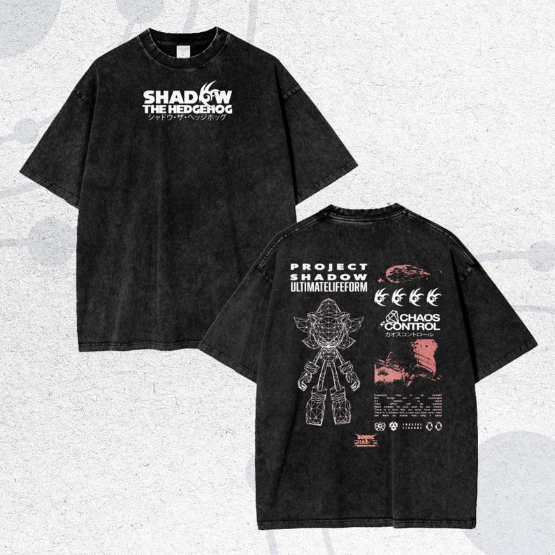 May include: Black t-shirt featuring the text "SHADOW THE HEDGEHOG" in white, with Japanese text below. The back of the shirt displays "PROJECT SHADOW ULTIMATELIFEFORM" and a graphic of a character, along with the text "CHAOS CONTROL".
