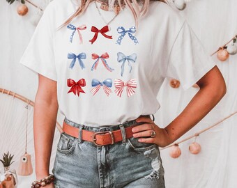 独立記念日のリボンシャツ、愛国的なTシャツ、独立記念日のTシャツ、アメリカのお祝いのシャツ、アメリカ国旗のTシャツ、お祭りのTシャツ、独立記念日のTシャツ