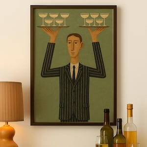 May include: A framed illustration depicts a server in a pinstripe suit holding trays of champagne glasses. The artwork hangs above a green cabinet with wine bottles and glasses. A wooden lamp with a tan shade is on the left.