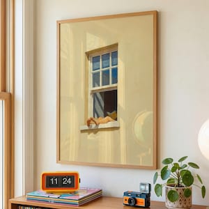 May include: A framed artwork shows a person relaxing in a window, with a yellow exterior wall and blue sky. An orange retro clock displays "11 24" on a shelf with vinyl records, a camera, and a potted plant. The artwork is in a room with a window.