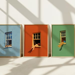 Peut inclure: Trois impressions d'art encadrées représentant des murs colorés avec des fenêtres. Chaque impression montre les jambes ou les bras d'une personne reposant sur le rebord de la fenêtre. Les murs sont peints en bleu, orange et vert, avec des cadres en bois.