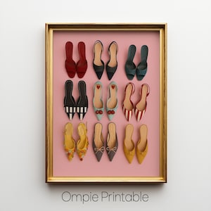 May include: A framed print showcasing a selection of miniature shoes in diverse styles and colours, such as red, black, blue, and yellow. The shoes are arranged on a pink background within a gold frame. The text "Ompie Printable" is at the bottom.