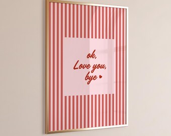 May include: Framed artwork with a gold border. The artwork features a pink and red striped background with a square in the center. The square contains the text "ok, Love you, bye" in a handwritten style font.