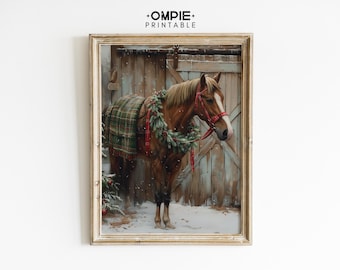 May include: A framed print of a brown horse wearing a red bridle and a green plaid blanket, adorned with a Christmas wreath. The horse stands in front of a wooden barn door, with snow on the ground.