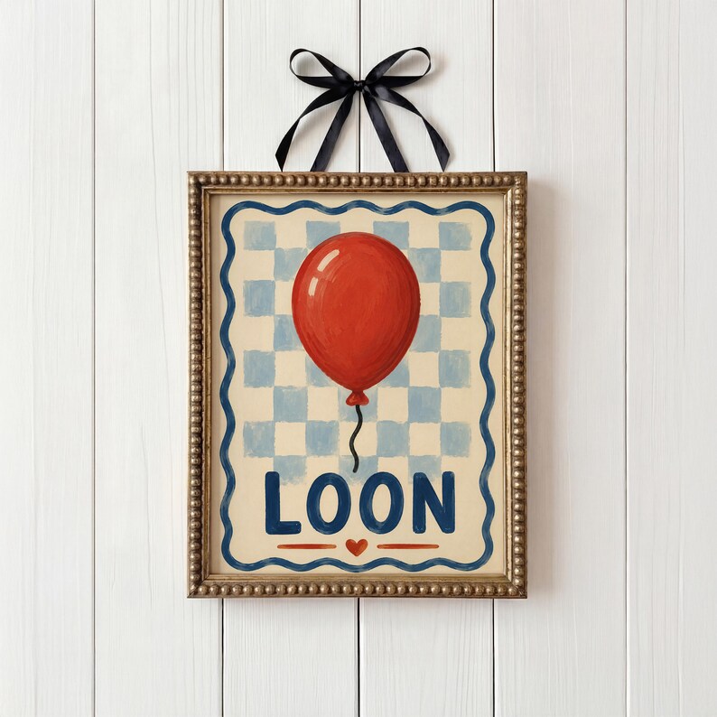 May include: A framed art print with a red balloon on a blue and white chequered background. The word "LOON" is written in blue letters below the balloon, with a red heart. The frame is gold with a black ribbon.