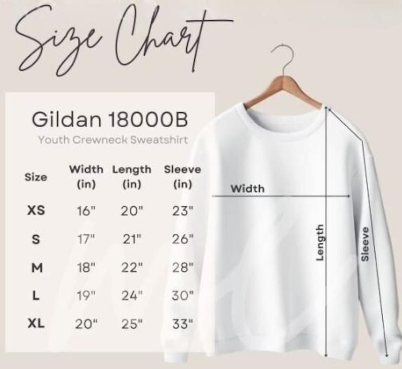 May include: A white Gildan 18000B youth crewneck sweatshirt hangs on a wooden hanger. The image includes a size chart with measurements in inches for width, length, and sleeve length, ranging from XS to XL.