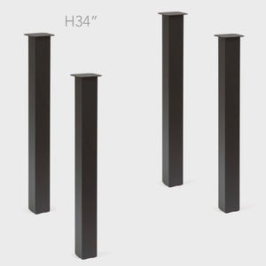May include: Four black table legs, each with a square top and a rectangular body. The legs are 34 inches tall. The design is modern and minimalist, suitable for various furniture projects.
