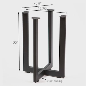 May include: A black metal table base with a rectangular design. The base is 22 inches tall, 12.5 inches wide, and 15.75 inches long. The tubing is 2" x 1".