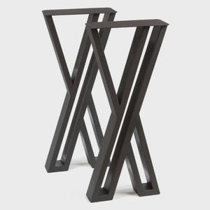 May include: Two dark gray metal table legs in an X-shape design. The legs are made of thick metal and have a matte finish. The legs are designed to support a tabletop and create a modern, industrial look. Each leg is approximately 28 inches tall.