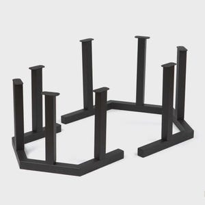 May include: Black metal table legs with a geometric design. The legs are rectangular and have a flat top, designed to support a tabletop. The legs are arranged in a hexagonal shape.