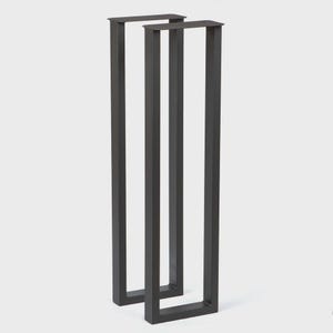 May include: Two dark gray, rectangular metal table legs. Each leg has a U-shaped design with a flat top and bottom. The legs are made of a sturdy metal and are designed to support a tabletop. The legs are shown against a white background.