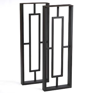 May include: Two black metal table legs with a geometric design. Each leg features a rectangular frame with a series of intersecting lines and shapes, creating an open, airy aesthetic. The legs are designed for furniture construction.